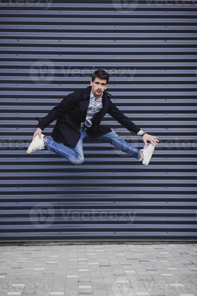 Trendy man jumping photo