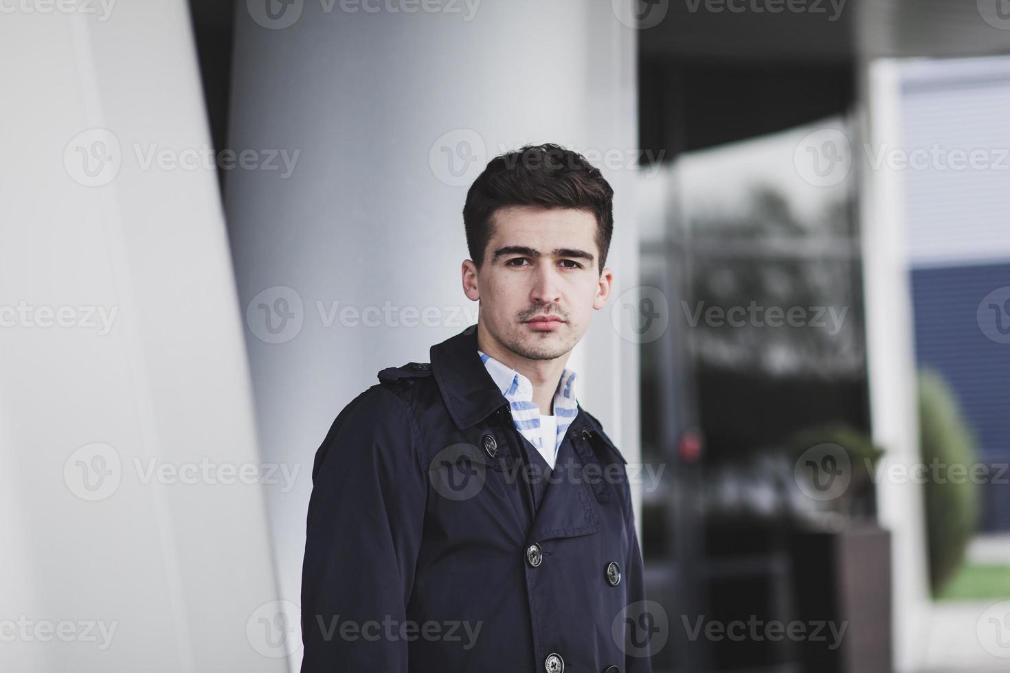 handsome young man in coat photo