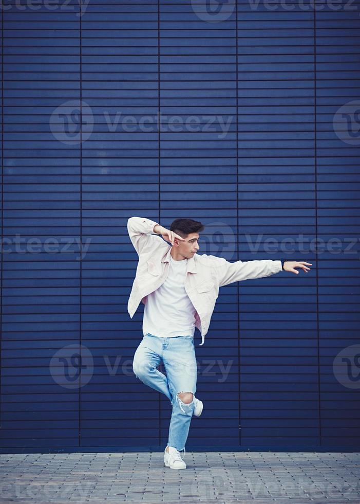 Young man wearing denim jacket photo