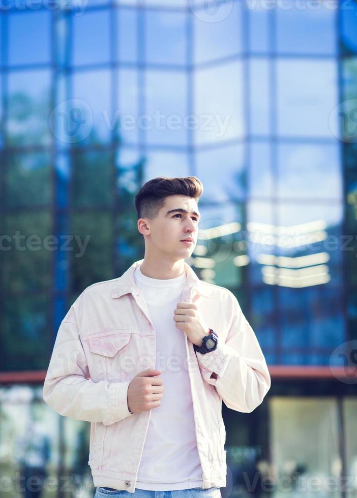 Portrait of stylish, stunning man in denim photo