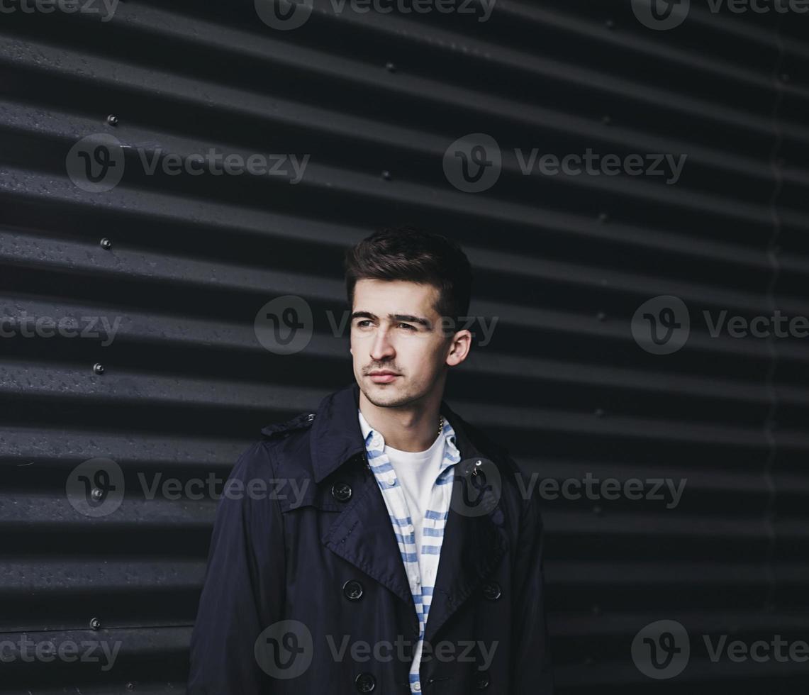 Portrait of a young handsome man wearing jacket photo