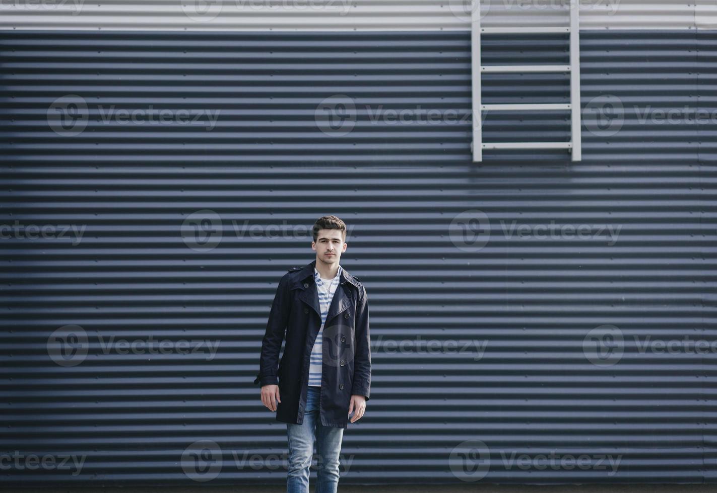handsome young man in urban setting photo