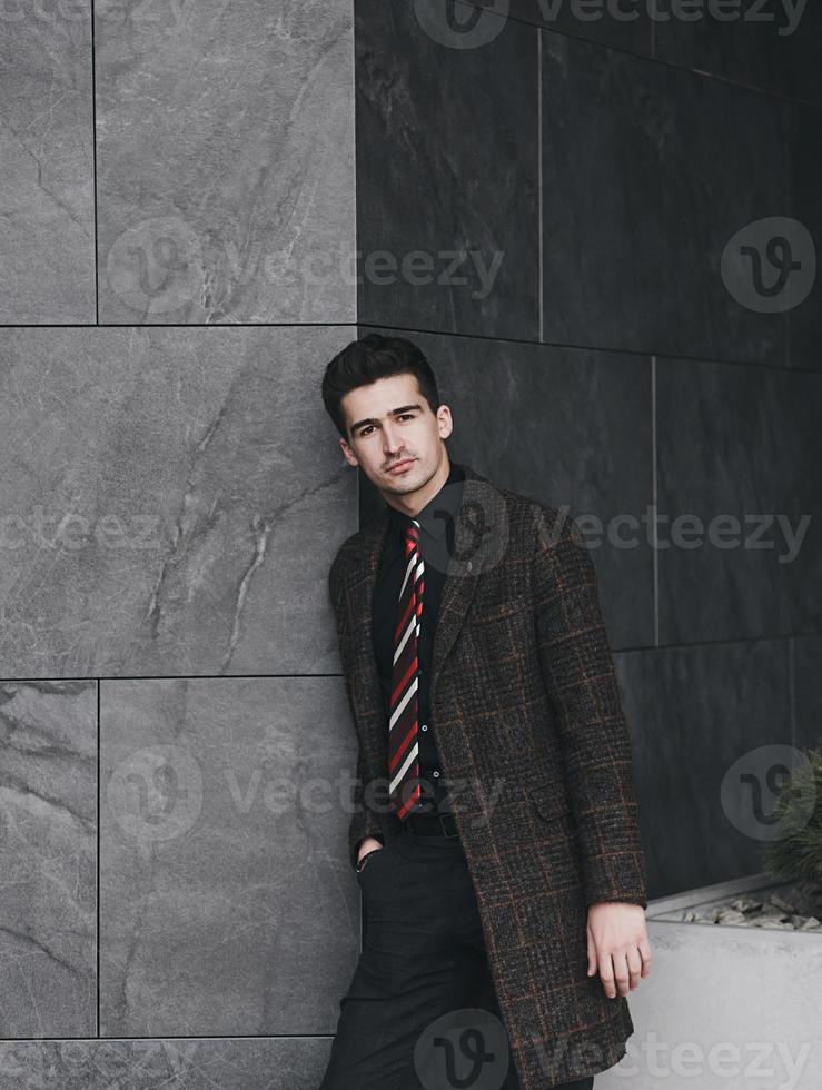 man in elegant suit in city photo