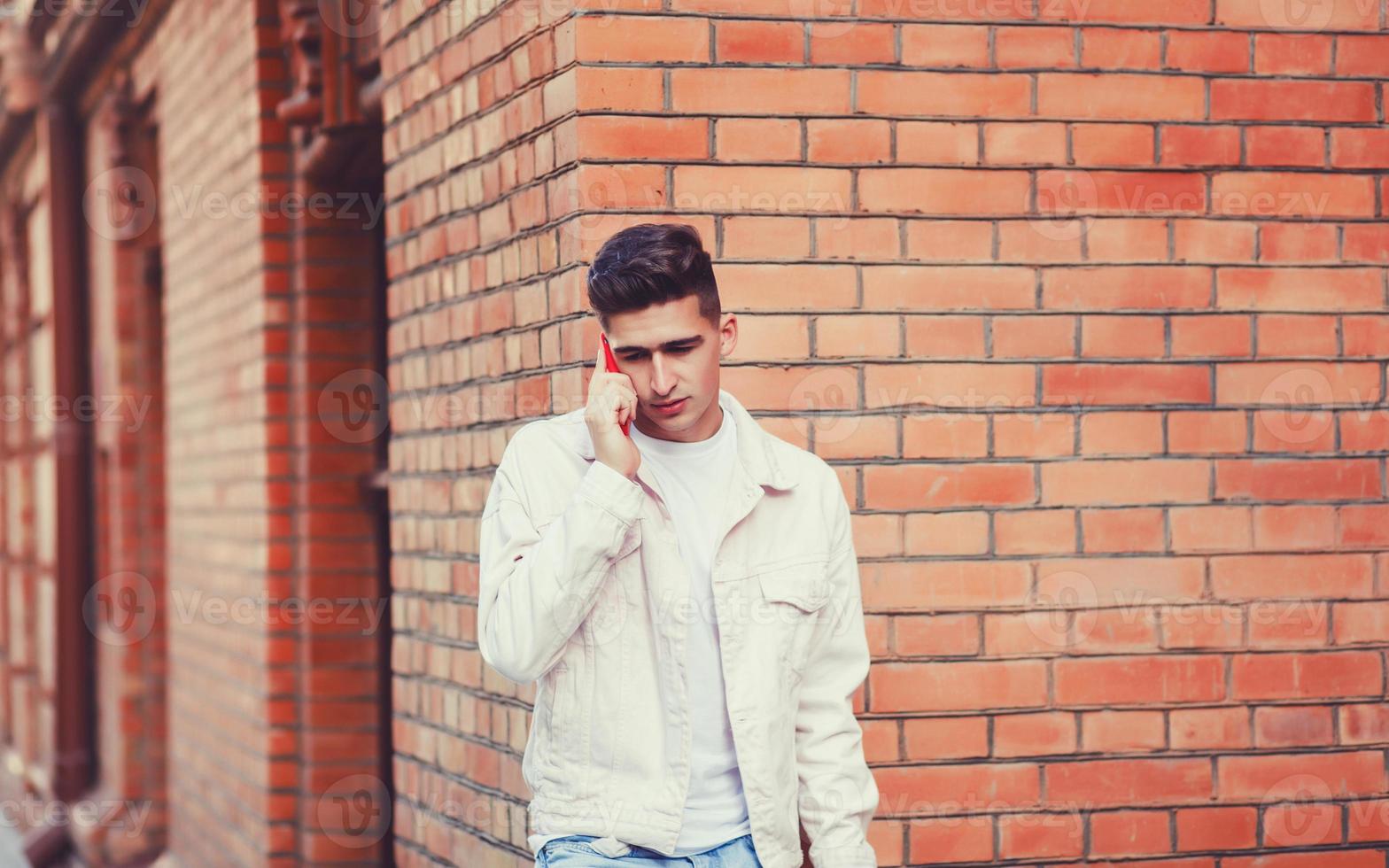 man talking with friend on phone photo
