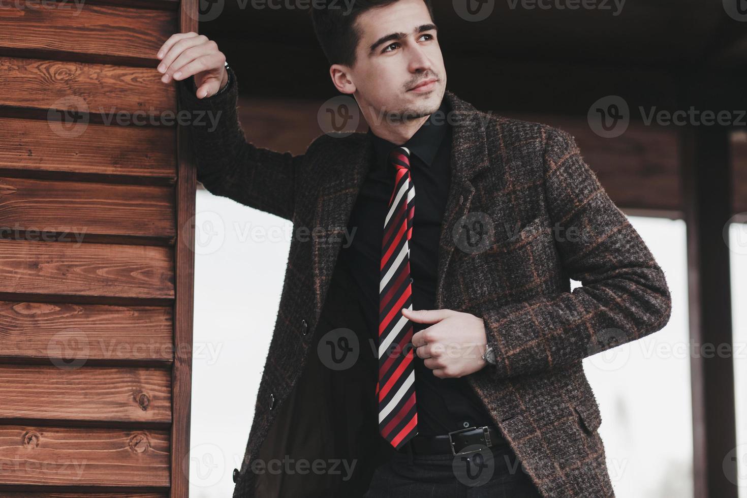 Handsome businessman in coat photo