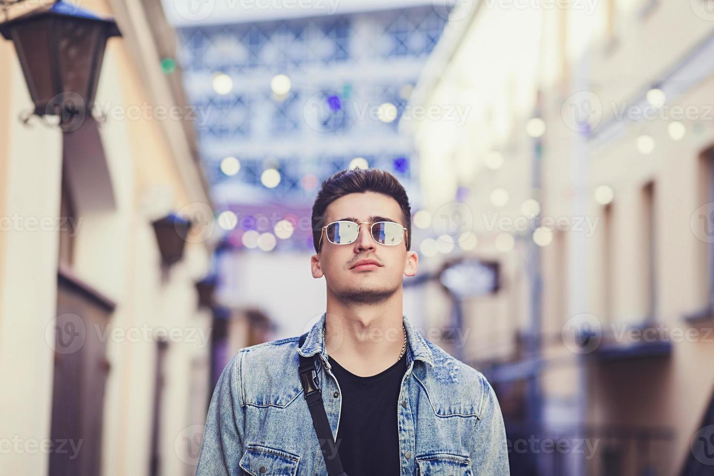 Portrait of handsome stylish hipster male model photo