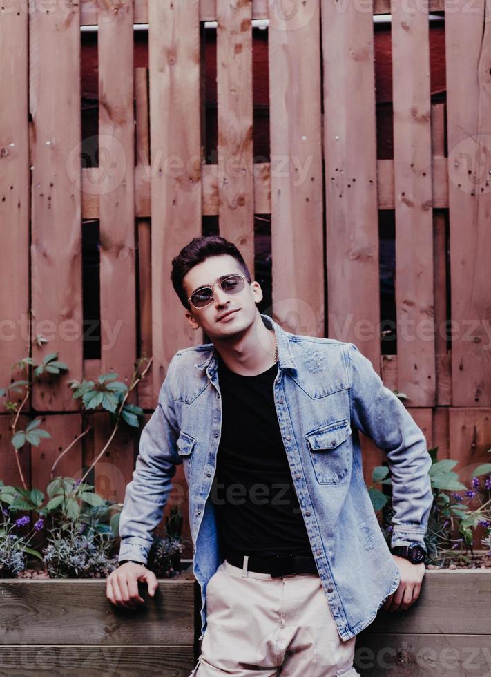 man in casual wear and sunglasses photo