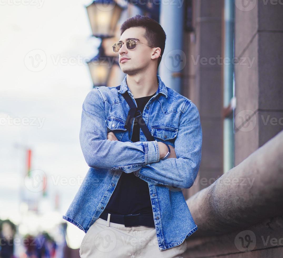 Handsome fashionable man in glasses photo