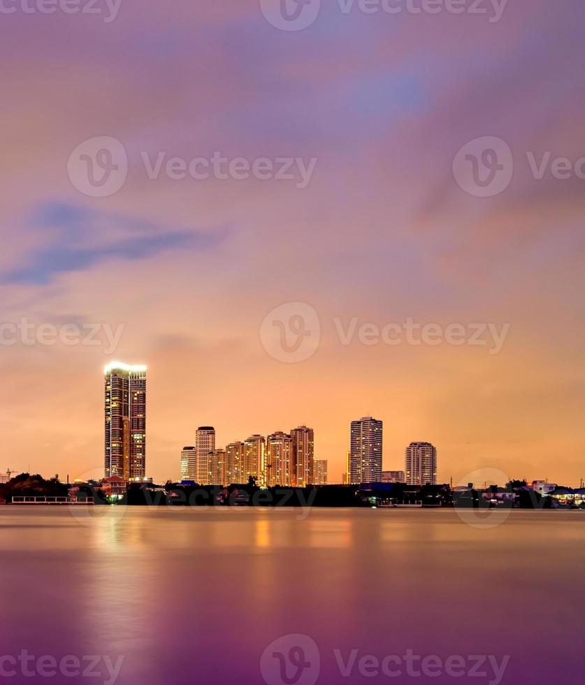 The small town near the river In the evening on a cloudy day photo