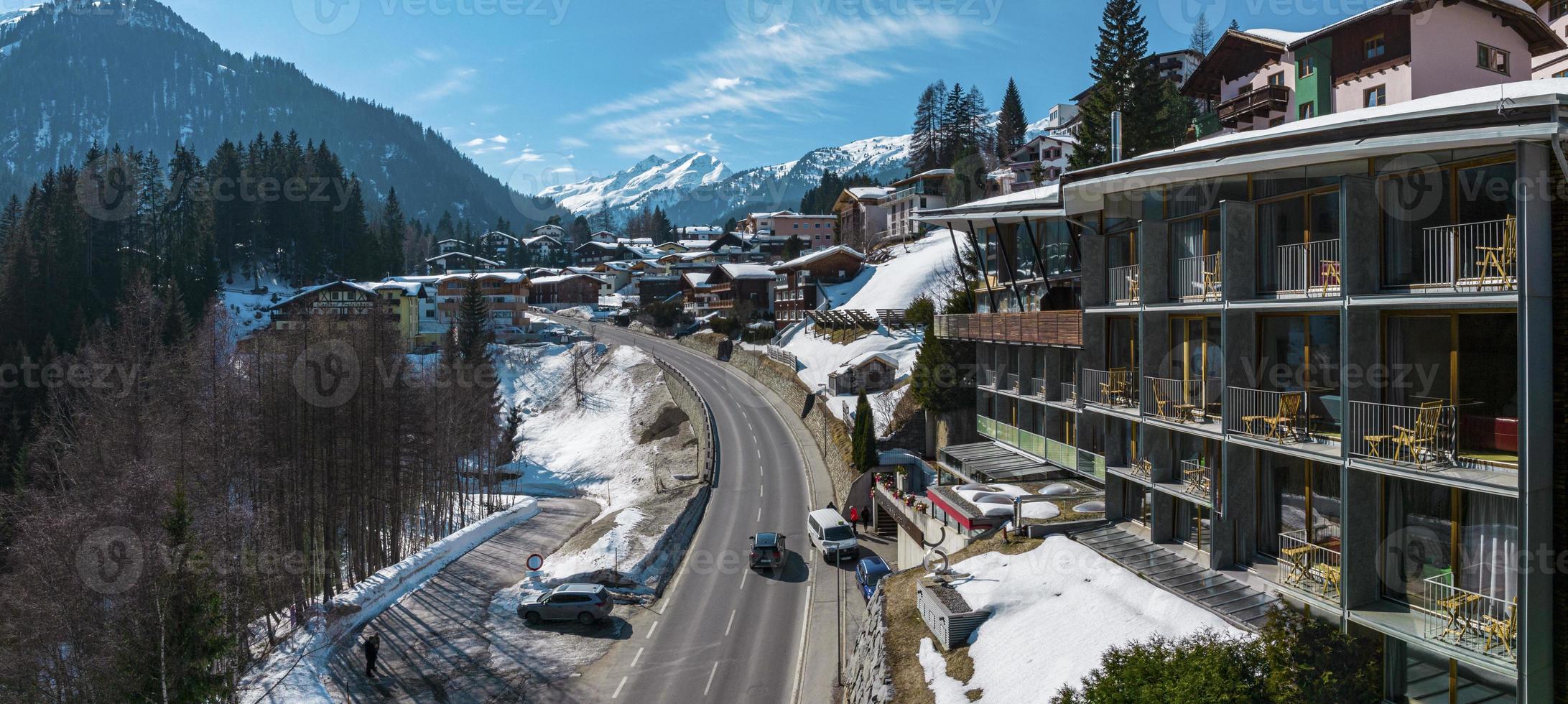 Ski resort town in beautiful snow covered alps mountain range photo