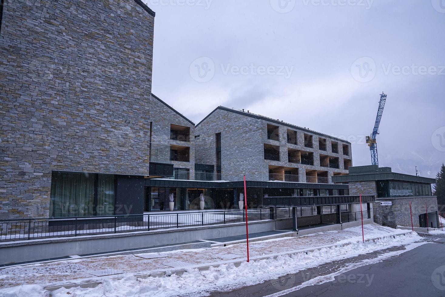 Exterior of san domenico ski resort building against sky photo