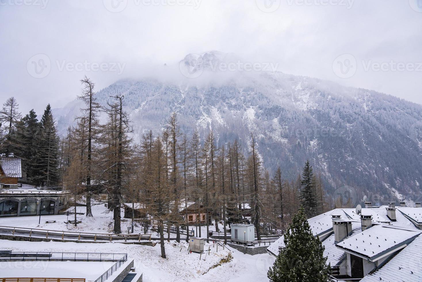 Scenic view of fog covered mountain seen from arlberg village photo