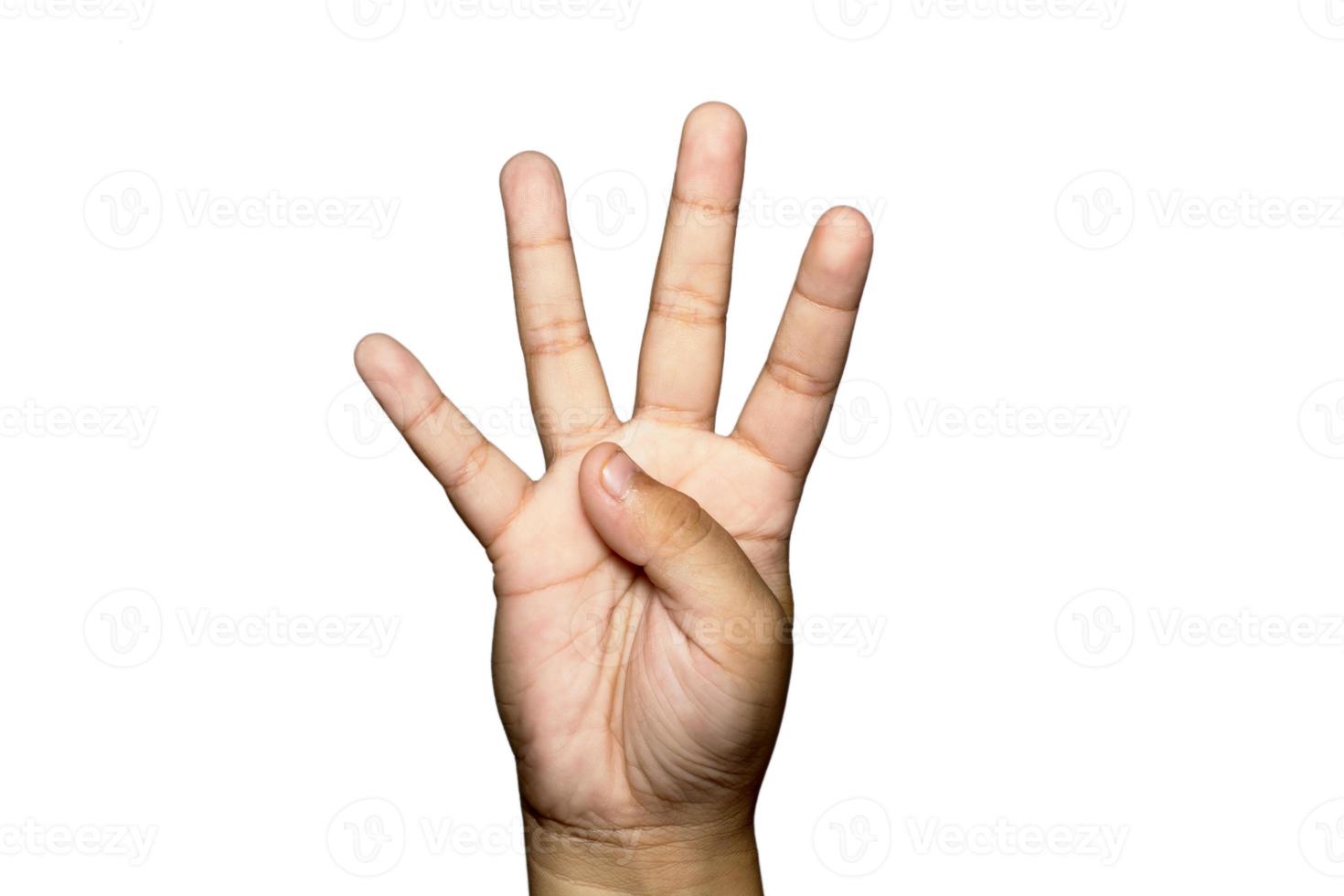 Boy raising four fingers up on hand on white background. photo