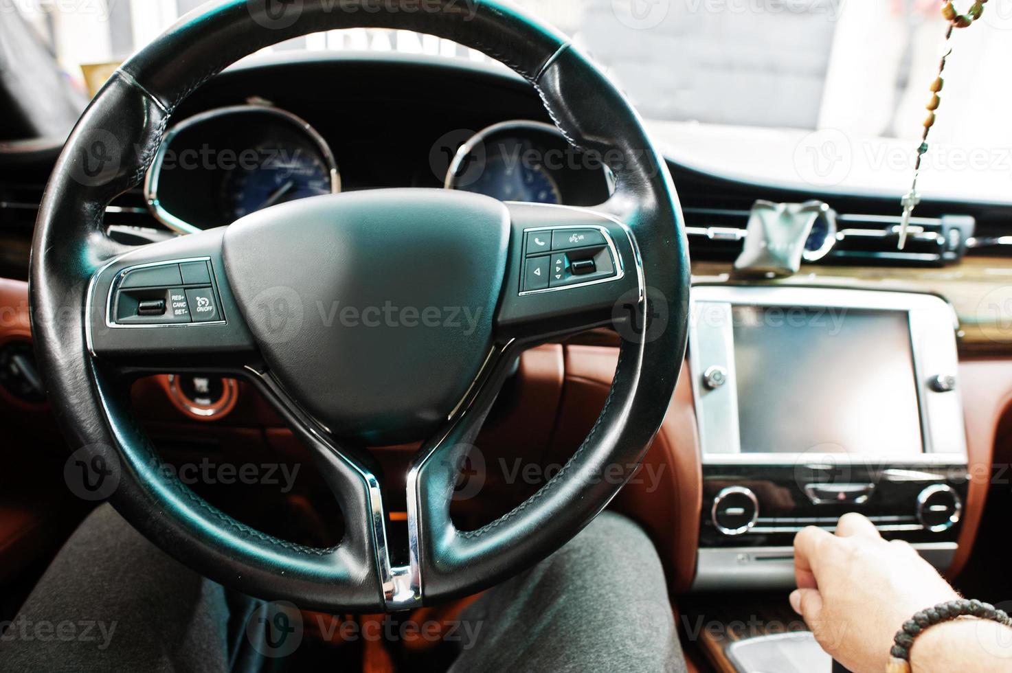 Car steering wheel interior of luxury transport. photo