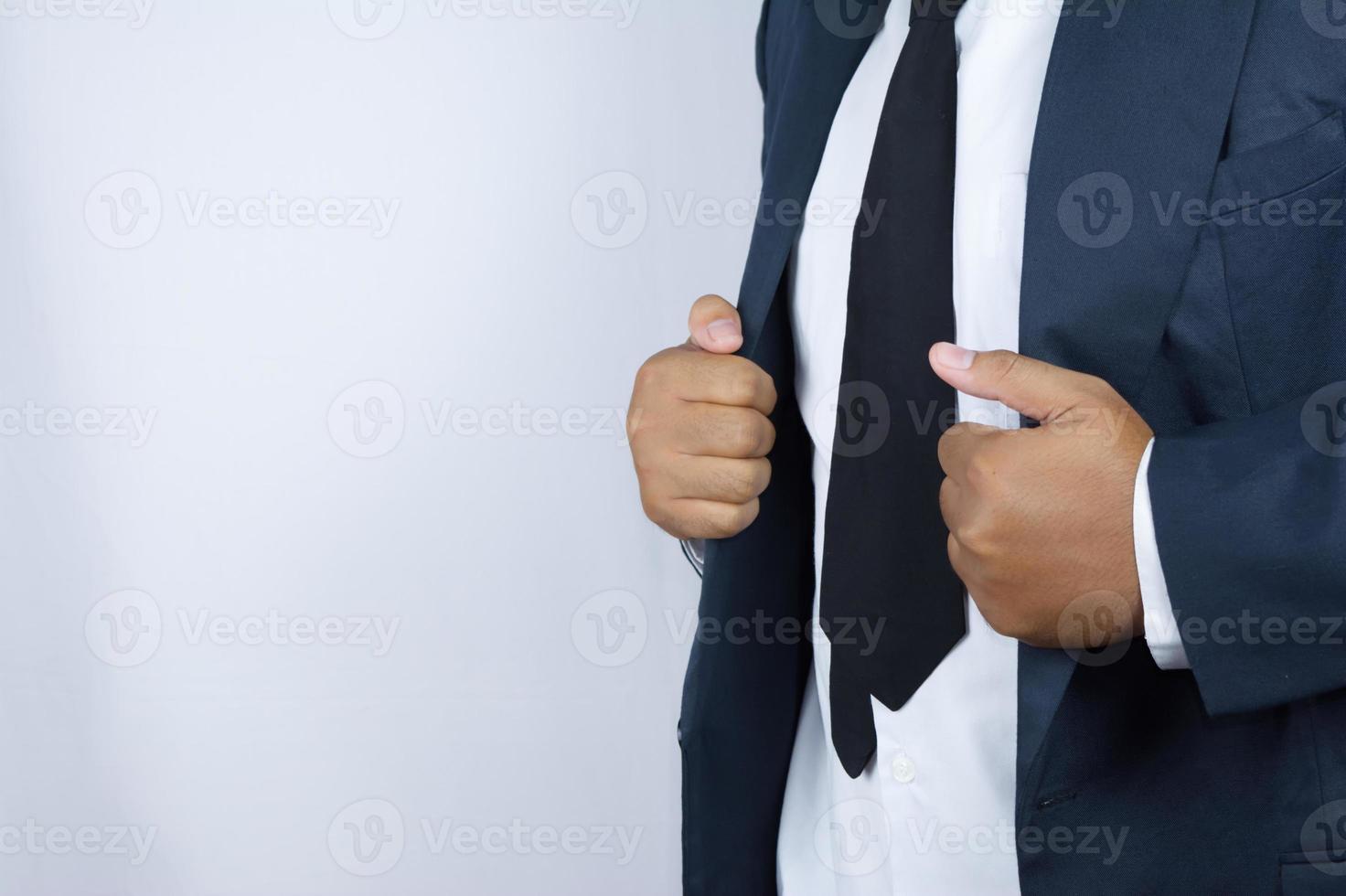 businessman is holding up his clothes photo