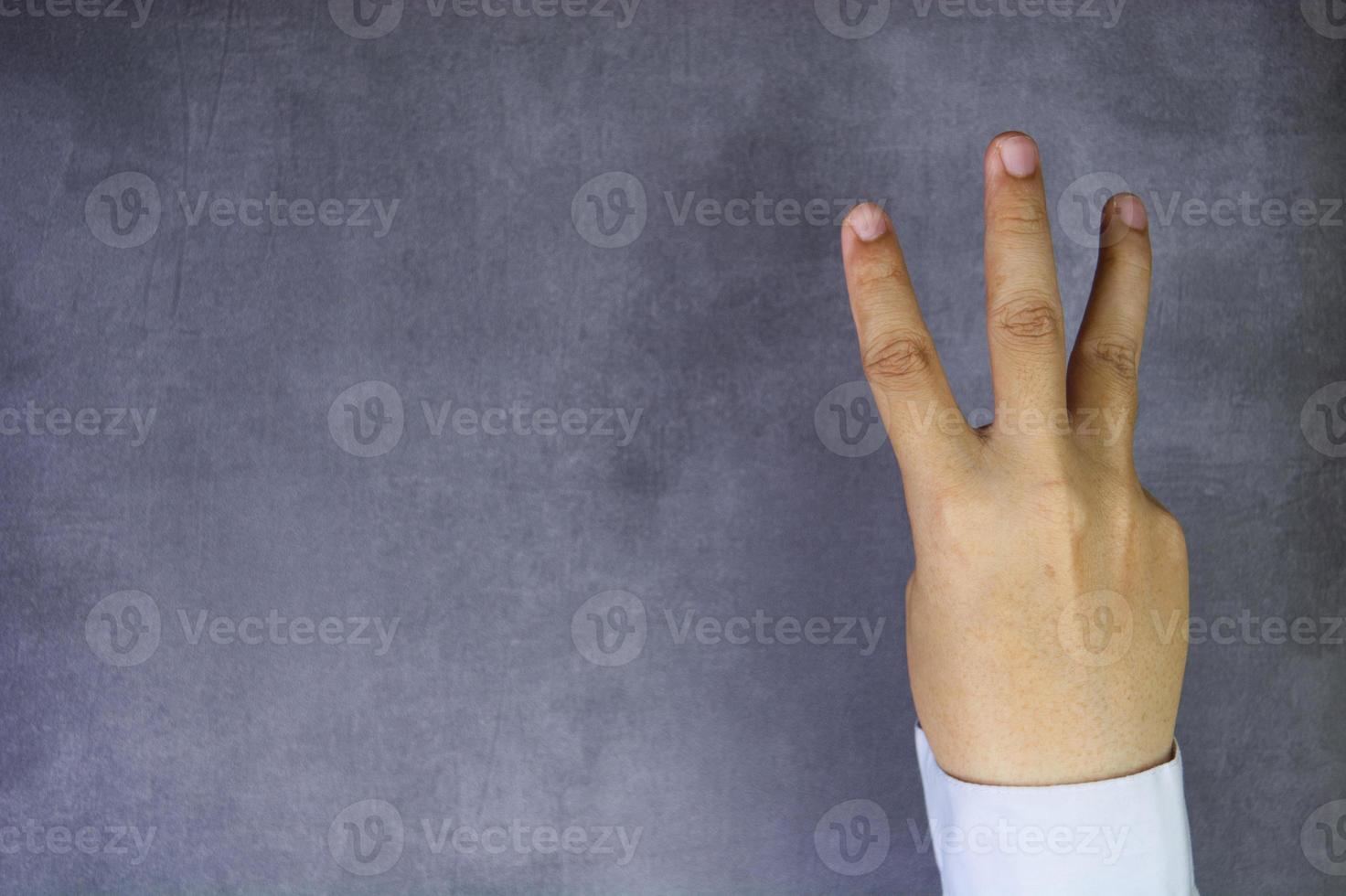 Three fingers of businessman photo