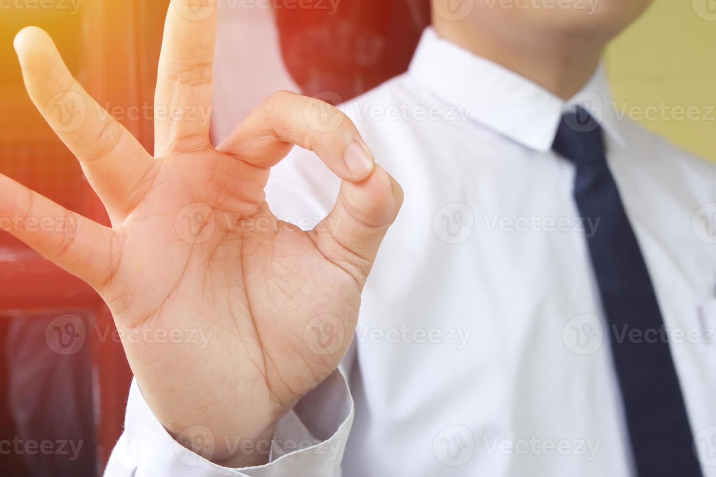 Gesture of okay from businessman photo