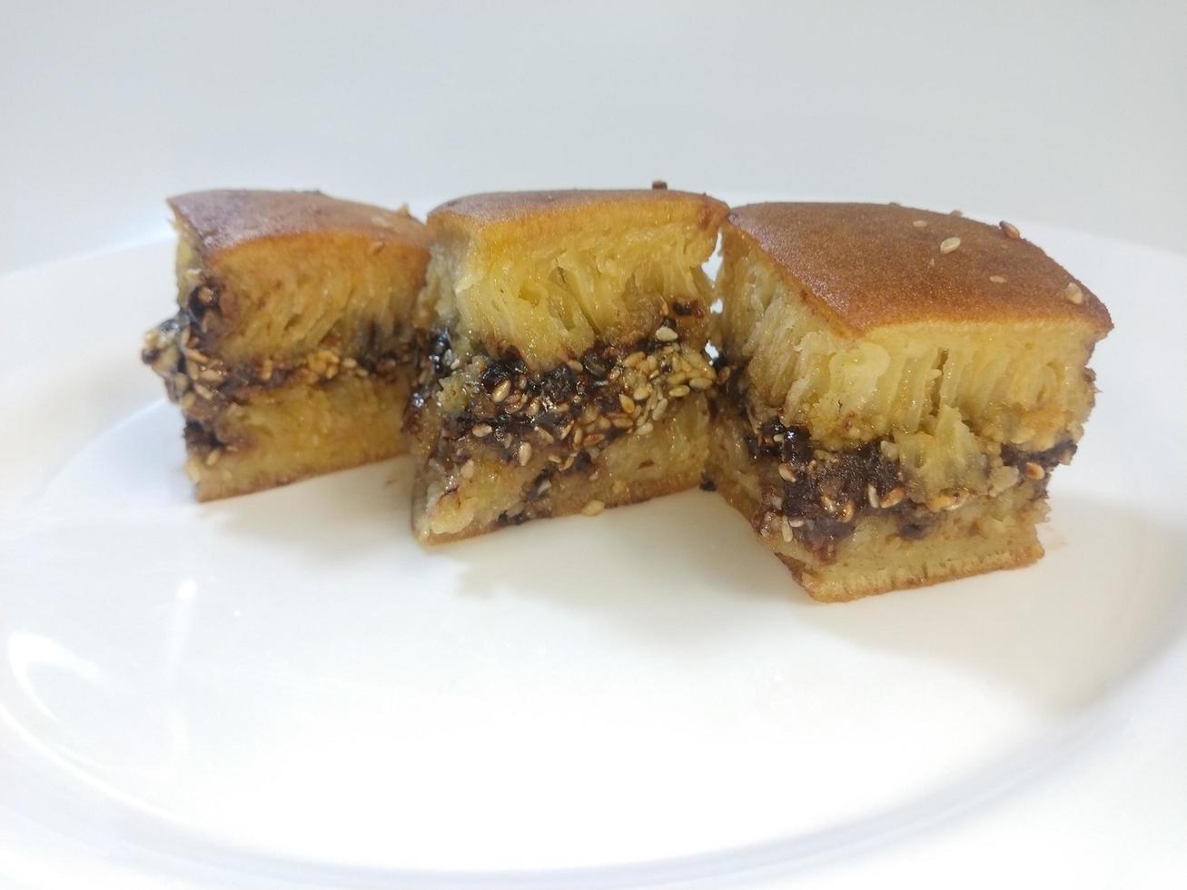 Sweet martabak, a typical food from Bangka Belitung, Indonesia, filled with peanut flour, milk chocolate and cheese dough photo