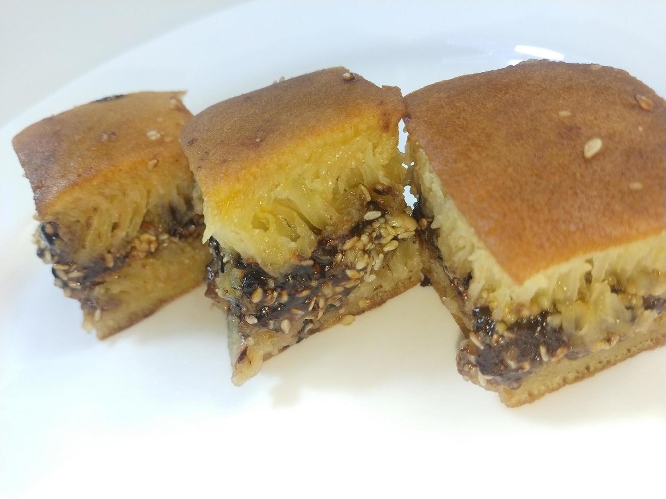 Sweet martabak, a typical food from Bangka Belitung, Indonesia, filled with peanut flour, milk chocolate and cheese dough photo