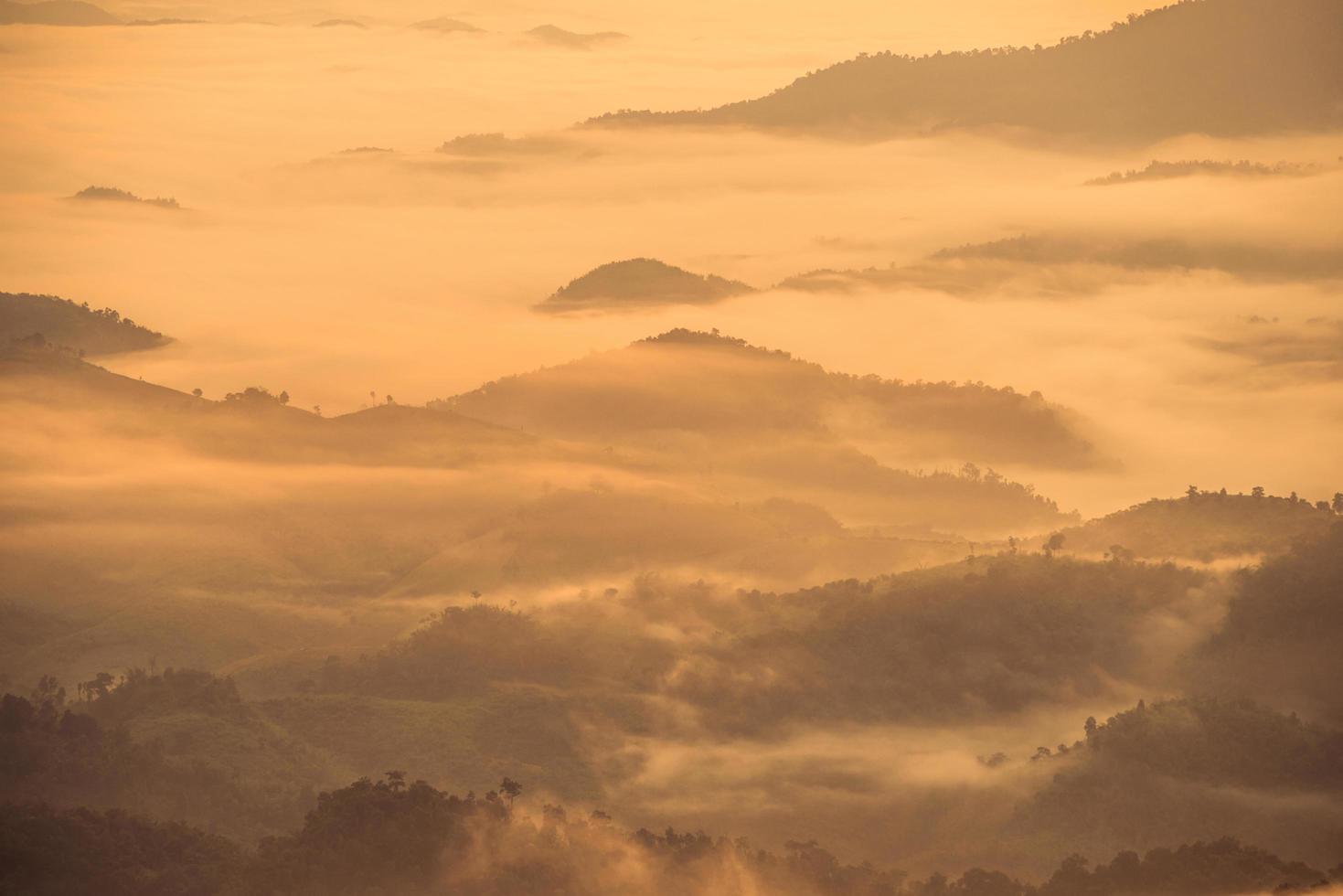 The fog covered the mountains range in Chiang Rai the province in northern region of Thailand in winter season. photo