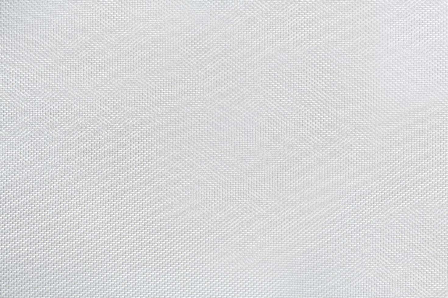 textura de lienzo blanco con piezas pequeñas de escamas de material, fondo de patrón abstracto foto