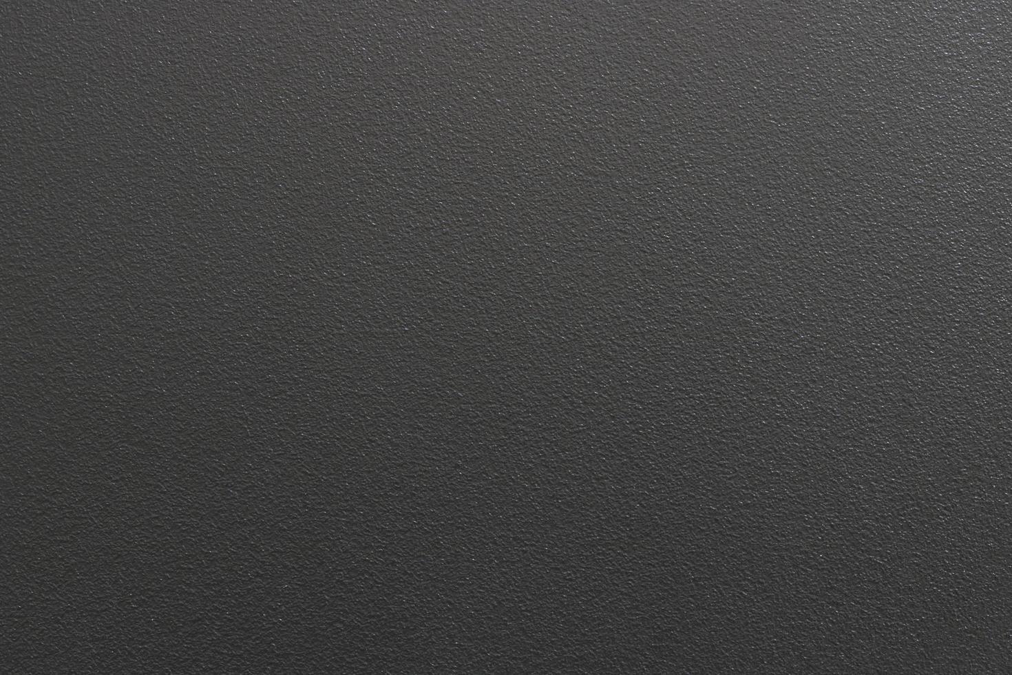 Texture of spray black paint on metallic plate, abstract pattern background photo