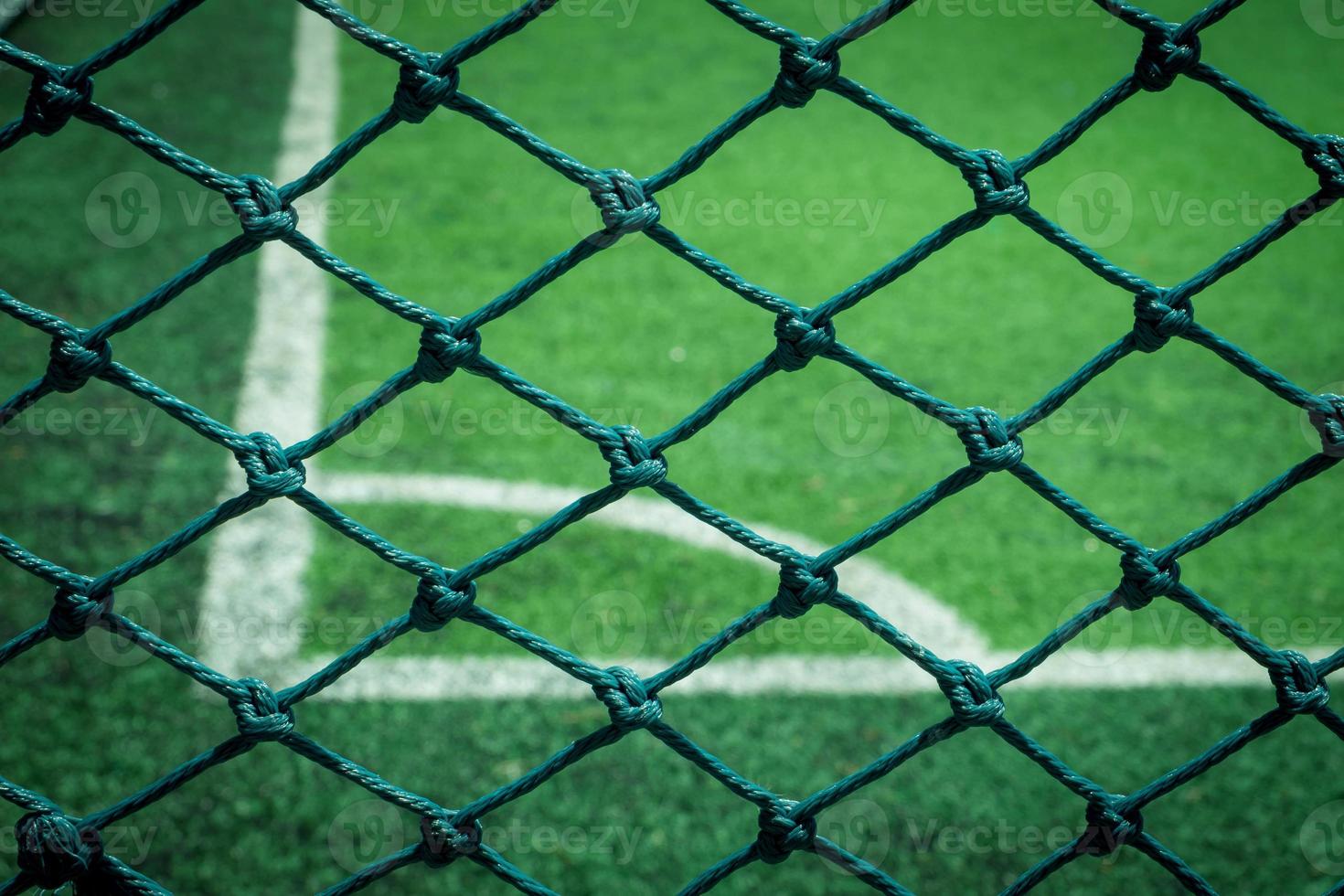 Net in front of artificial turf of Soccer football field. photo