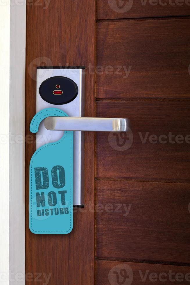 hanger do not disturb sign on electronic lock door photo