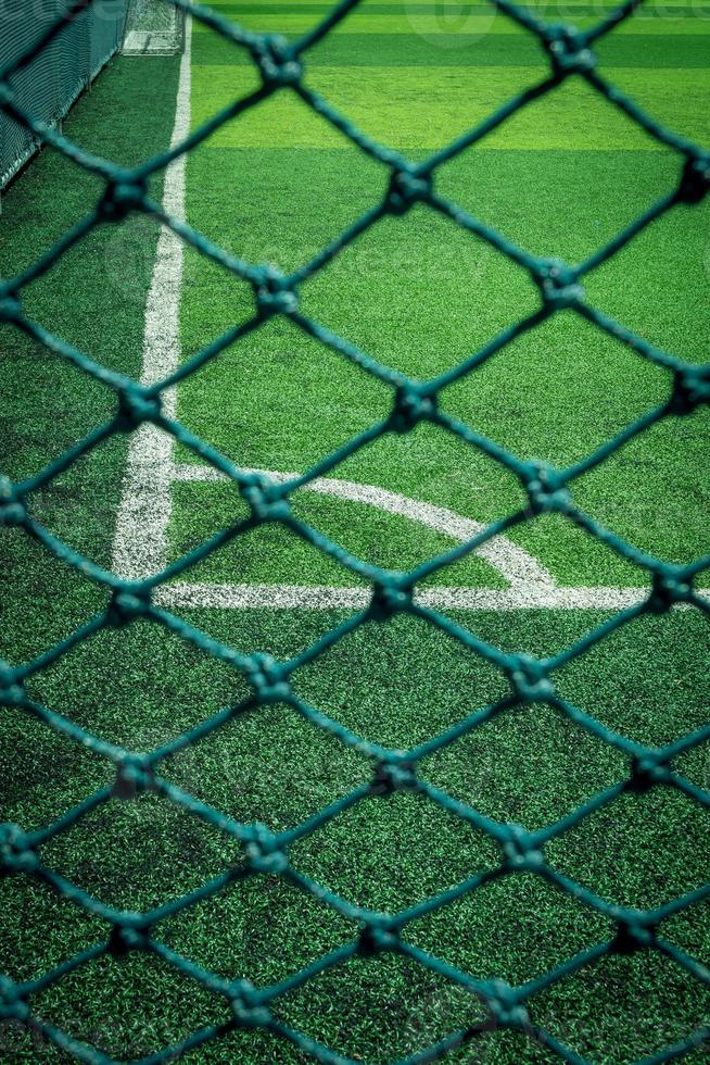 Net in front of artificial turf of Soccer football field. photo