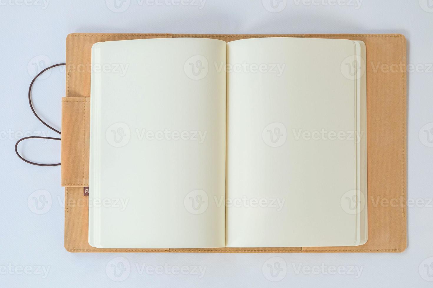 Blank Notebook on a White Paper Background photo