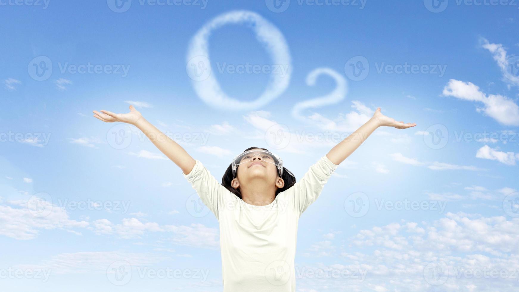 science kid happy fresh air on clear sky with cloud as ozone symbol photo