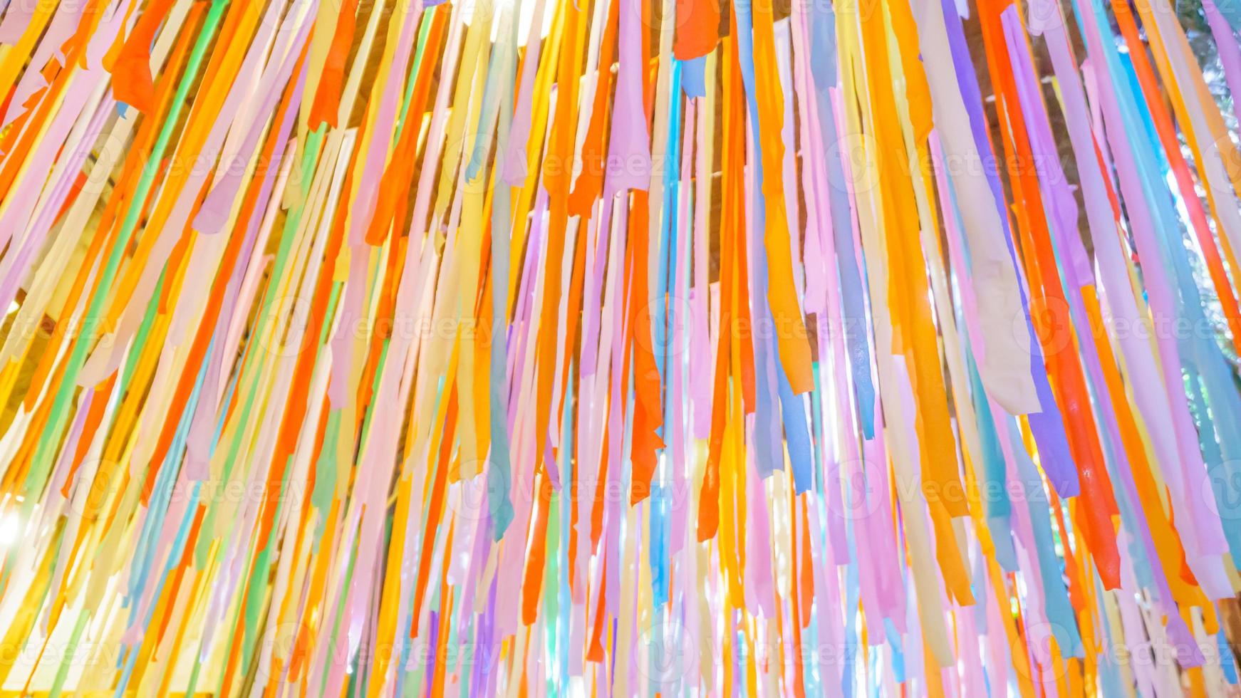 The fabrics that are cut into strips of various colors are beautifully hung. photo