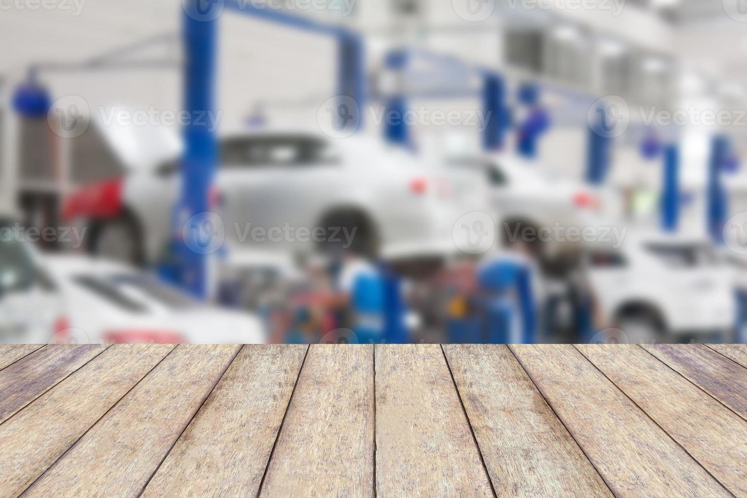 Wood table top with blur garage background photo