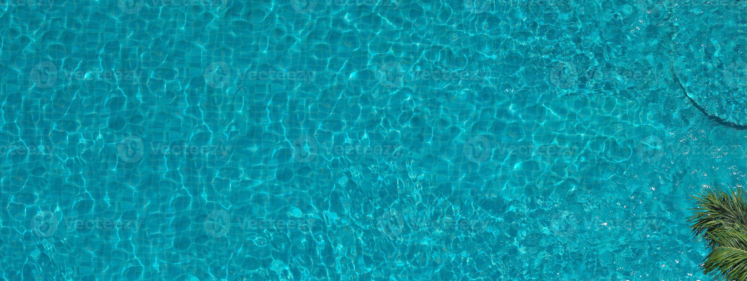 Aerial view images of swimming pool in a sunny day. photo