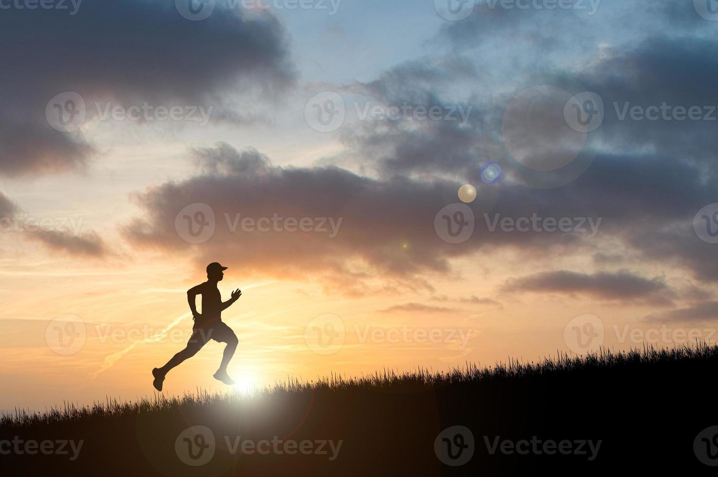 Running man silhouette in sunset time.  silhouette for a runner training in the evening. Sunsets photo