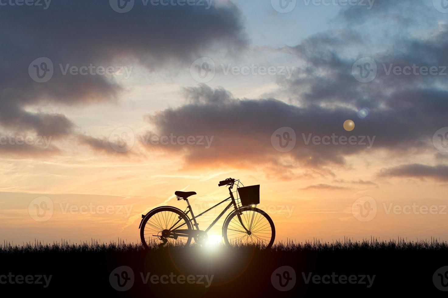 Silhouettes of bicycles parked in a beautiful photo