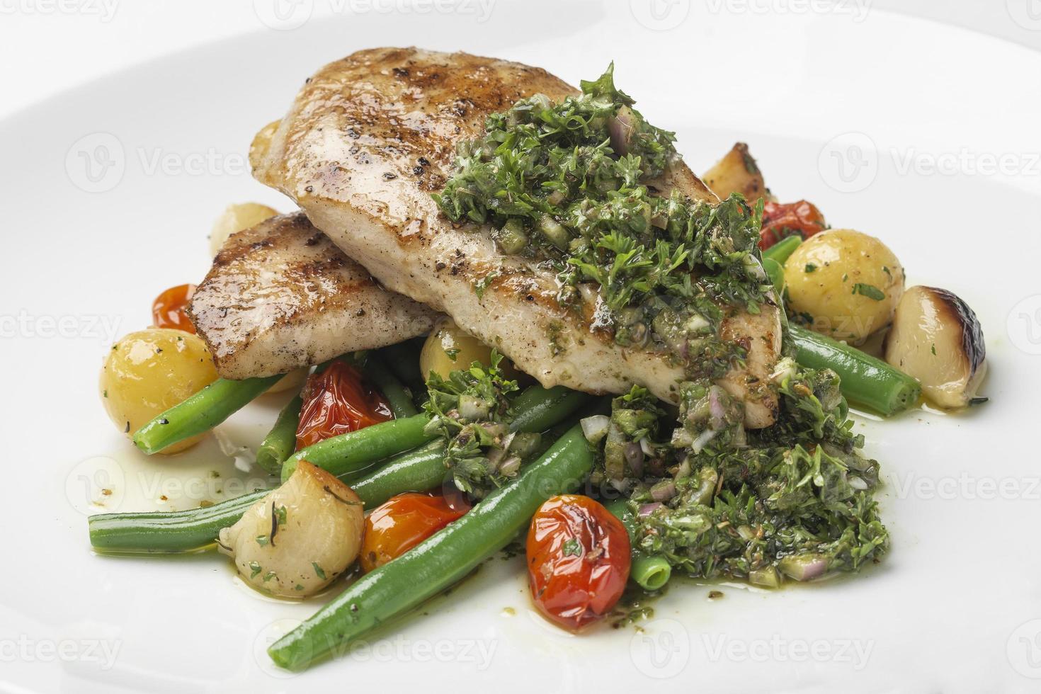 grilled chicken breast with argentina chimichurri sauce and vegetables meal photo