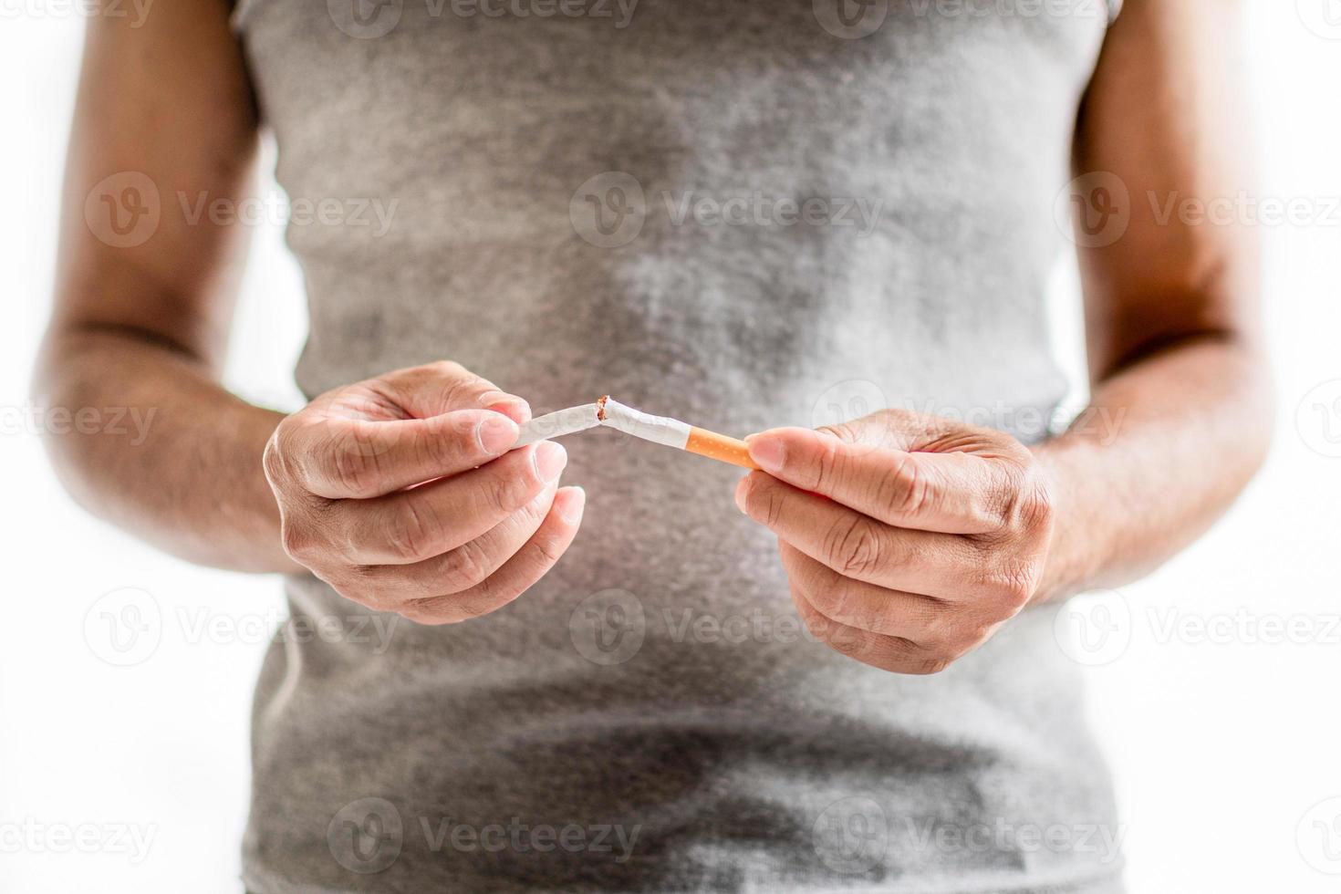 Concept World No Tobacco Day takes place around the world on 31 May every year. It aims to promote the abstention of all forms of tobacco consumption for 24 hours. Closeup. White blurred background photo