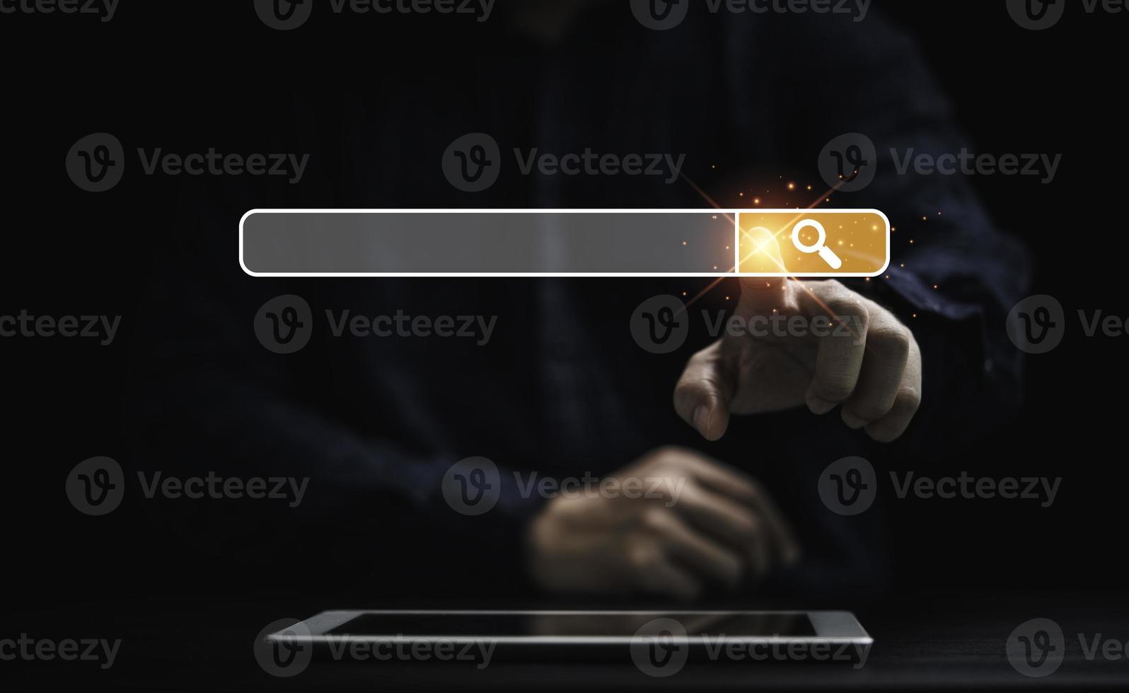 Businessman using tablet and touching to search engine bar for Searching information network concept. photo