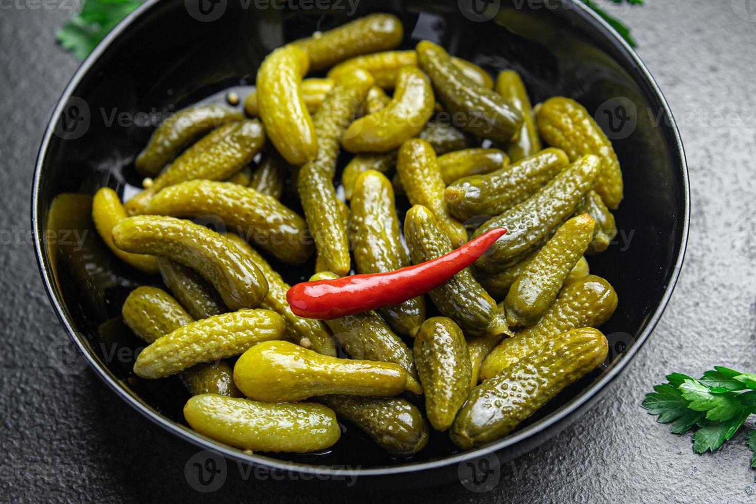 gherkins cucumbers salted pickled vegetable food meal food diet snack on the table copy space photo