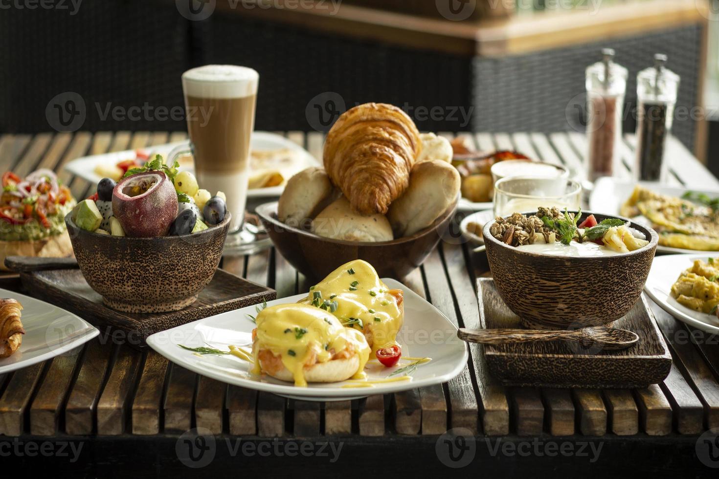 Western big gourmet breakfast selection mixed dishes on restaurant table photo