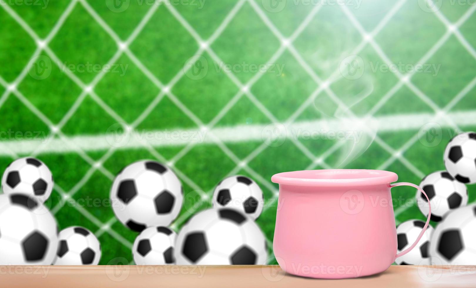 Cup of coffee with football background photo