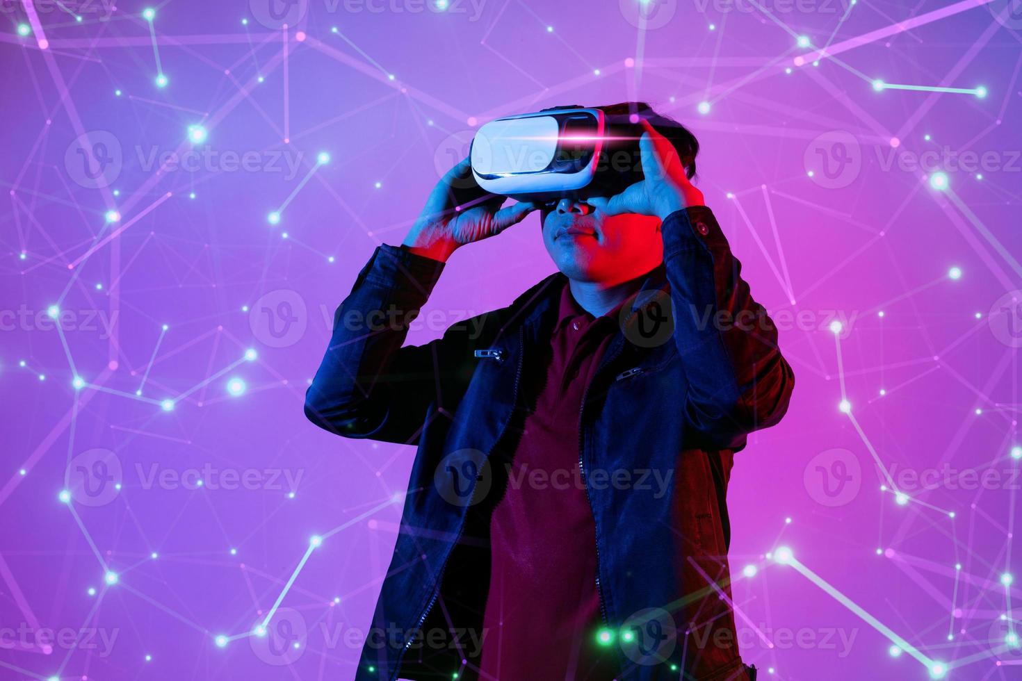 Metaverse digital cyber world technology, man with virtual reality VR goggle playing AR augmented reality game and entertainment photo