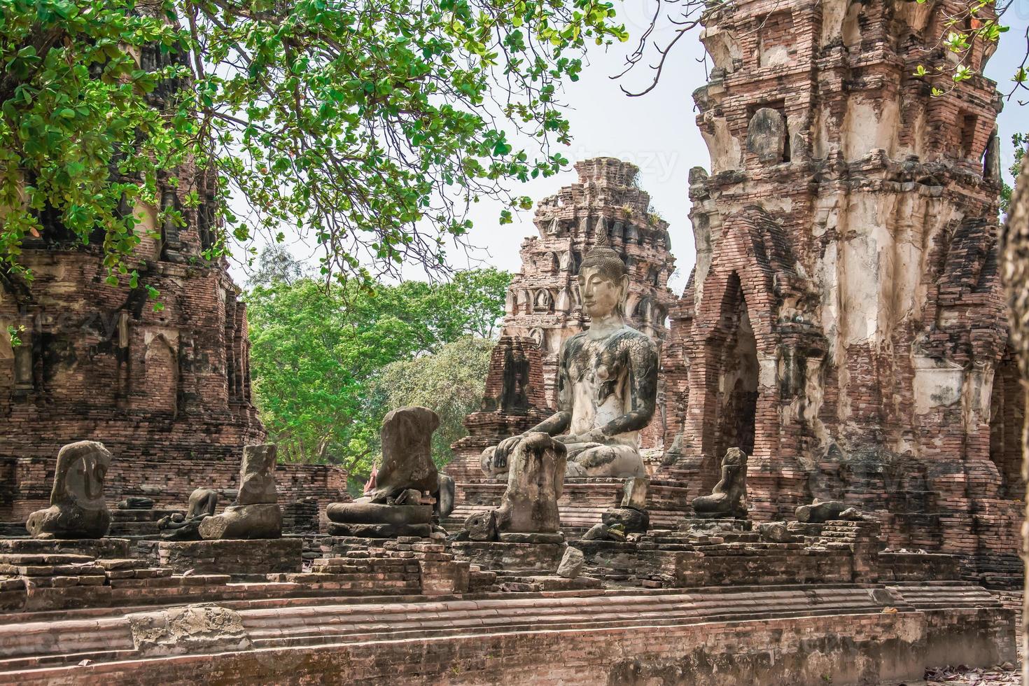 THAILAND Ruins and Antiques at the Ayutthaya Historical Park Tourists from around the world Buddha decay photo