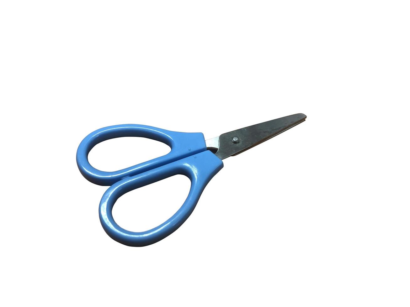 Small blue scissors on white background with clipping path photo