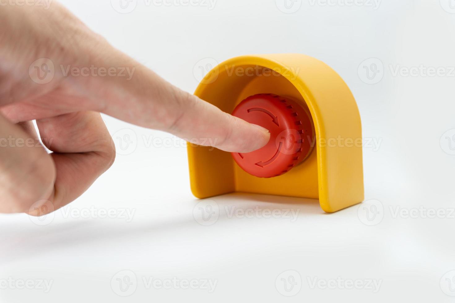 Stop Red Button and the Hand of Worker About to Press it. emergency stop button. Big Red emergency button or stop button for manual pressing. photo