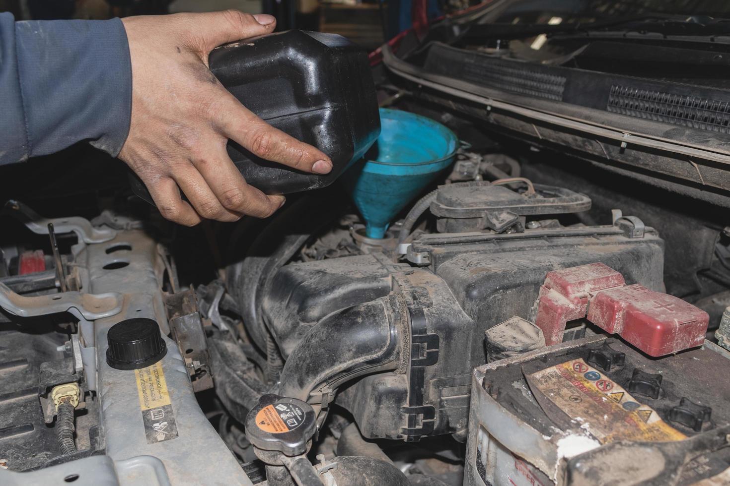 The mechanic is checking the engine. photo