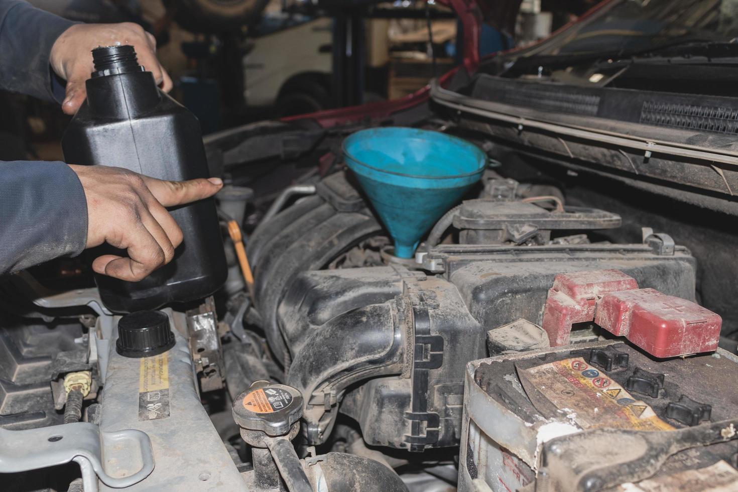 The mechanic is checking the engine. photo