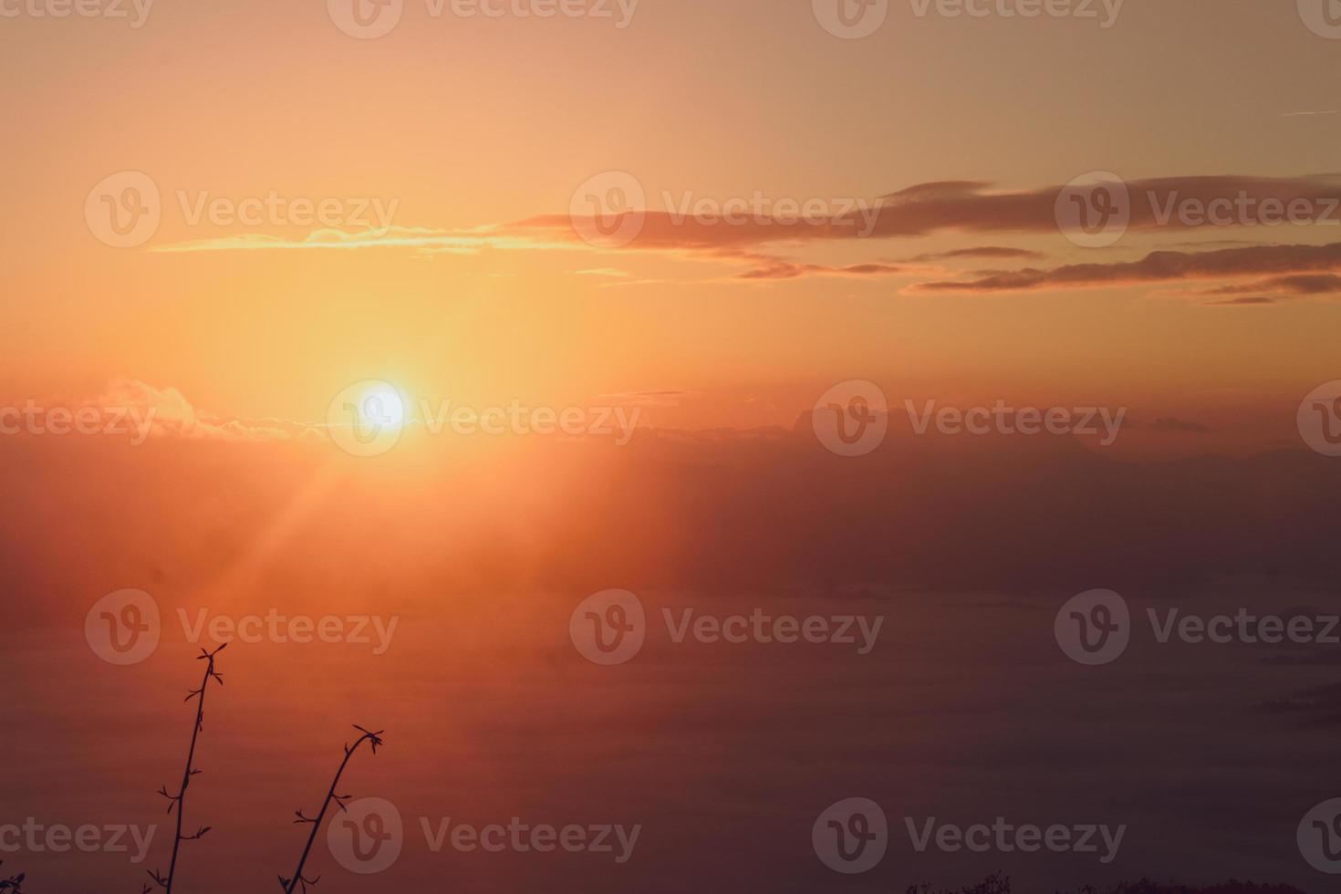 colorful sky with sun in clouds of altitude photo