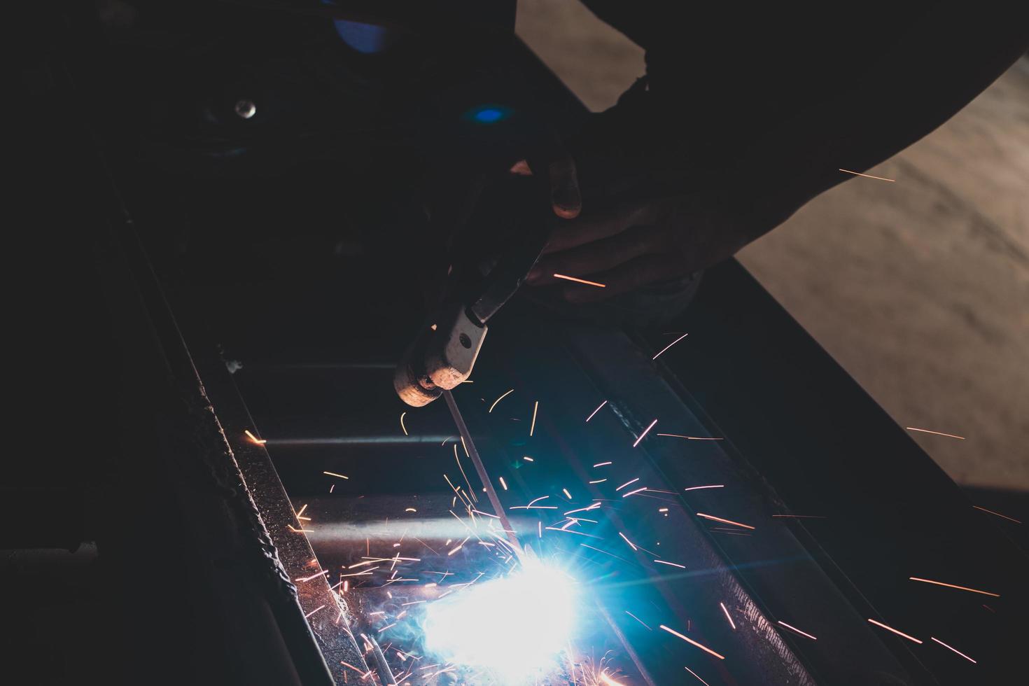 welder, welding automotive part in a car factory photo